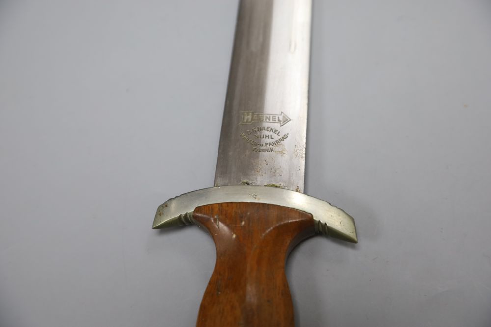 A German WW2 Third Reich SA dagger, by C. G. Haenel, Suhl, the 22cm blade, inscribed Alles Fur Deutschland with brown nickel mounted